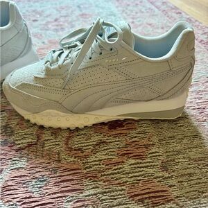 Brand new Puma sneakers.  Only worn once.  Size 7.